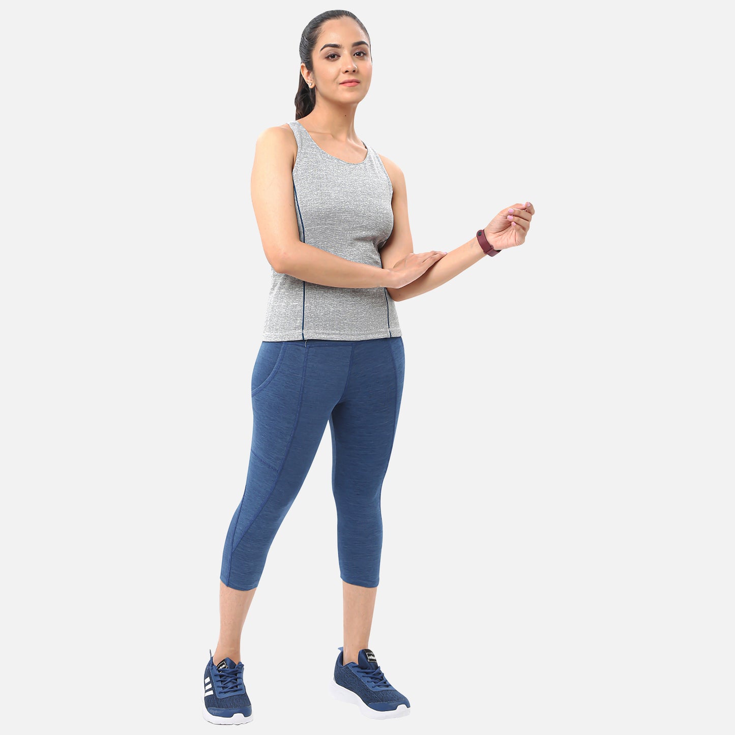 Casual womens knitted mid-blue denim yoga capris with pockets, perfect for adding functionality and style to your workout wardrobe, available online