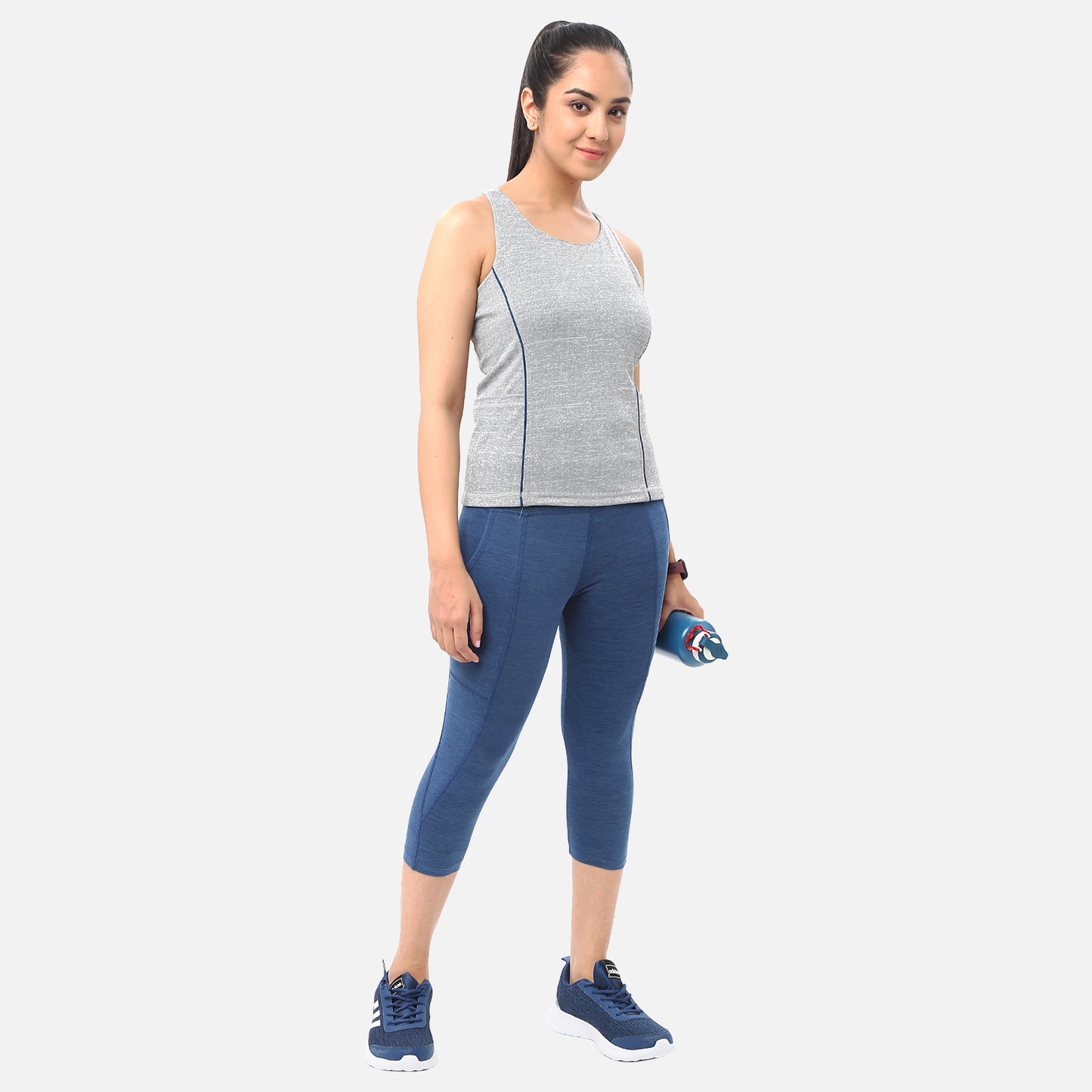 Casual womens knitted mid-blue denim yoga capris with pockets, perfect for adding functionality and style to your workout wardrobe, available online