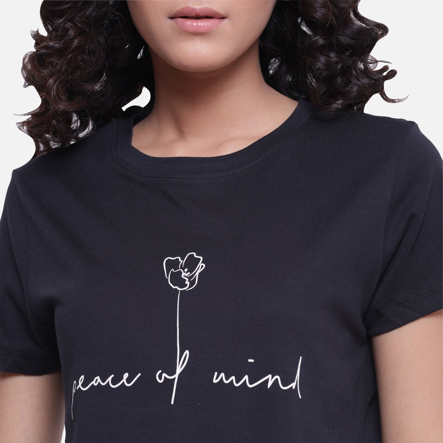 Women's black T-shirt with a bold white quote, perfect for a stylish and edgy look, available online