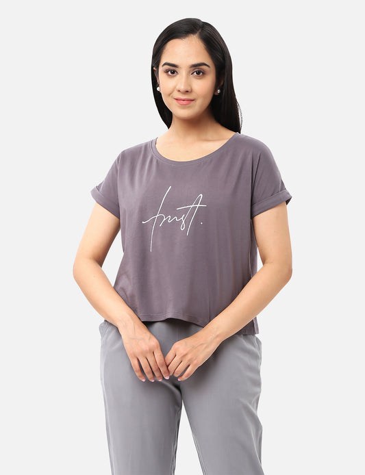 Casual womens grey crop top adorned with a catchy quote, ideal for a chic and positive style, available online