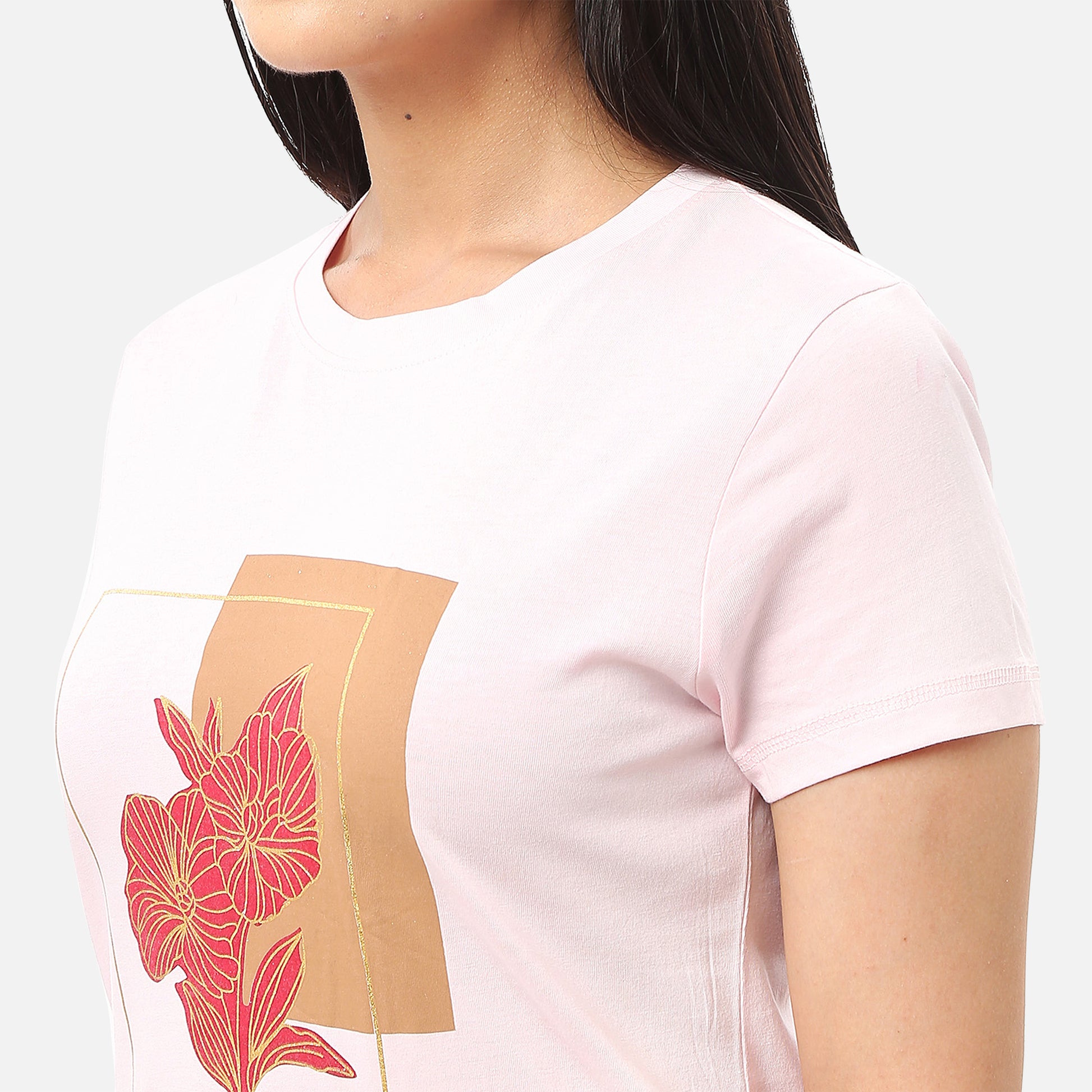Stylish pink T-shirt for women with a gold foil message and red floral design, ideal for a unique and elegant look, available online