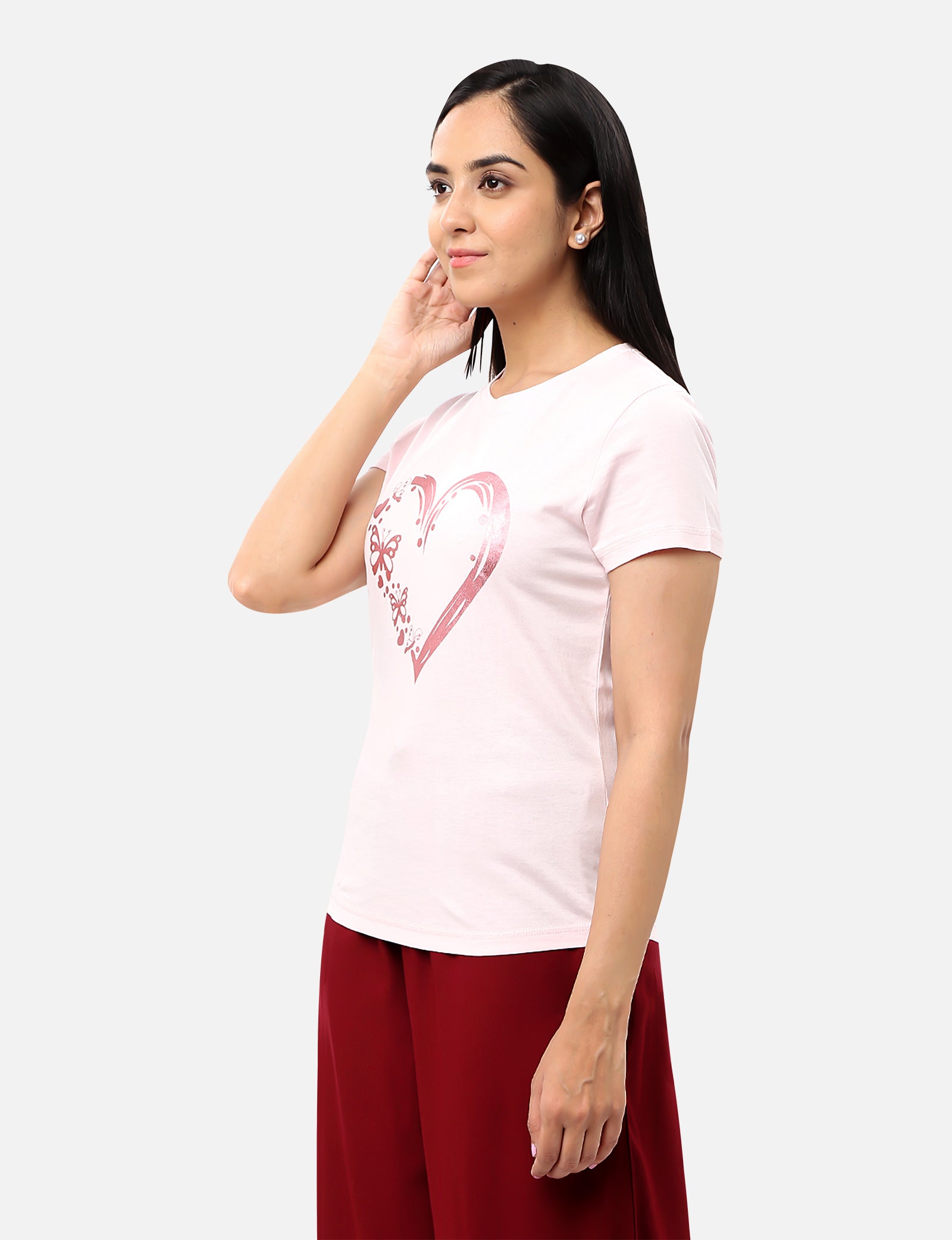 Womens light baby pink T-shirt featuring a glitter heart design, perfect for adding a touch of glamour to your wardrobe, available online
