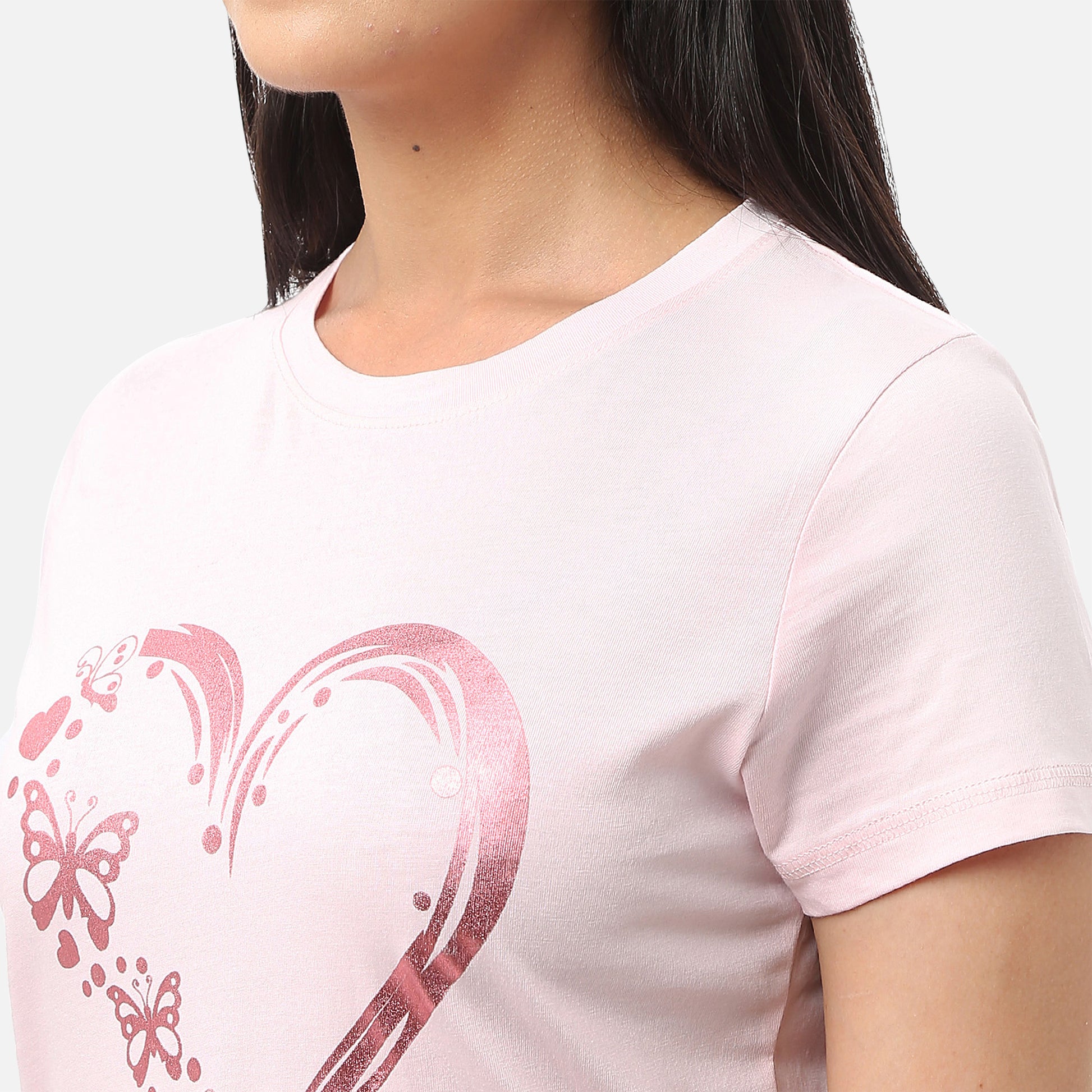Womens light baby pink T-shirt featuring a glitter heart design, perfect for adding a touch of glamour to your wardrobe, available online